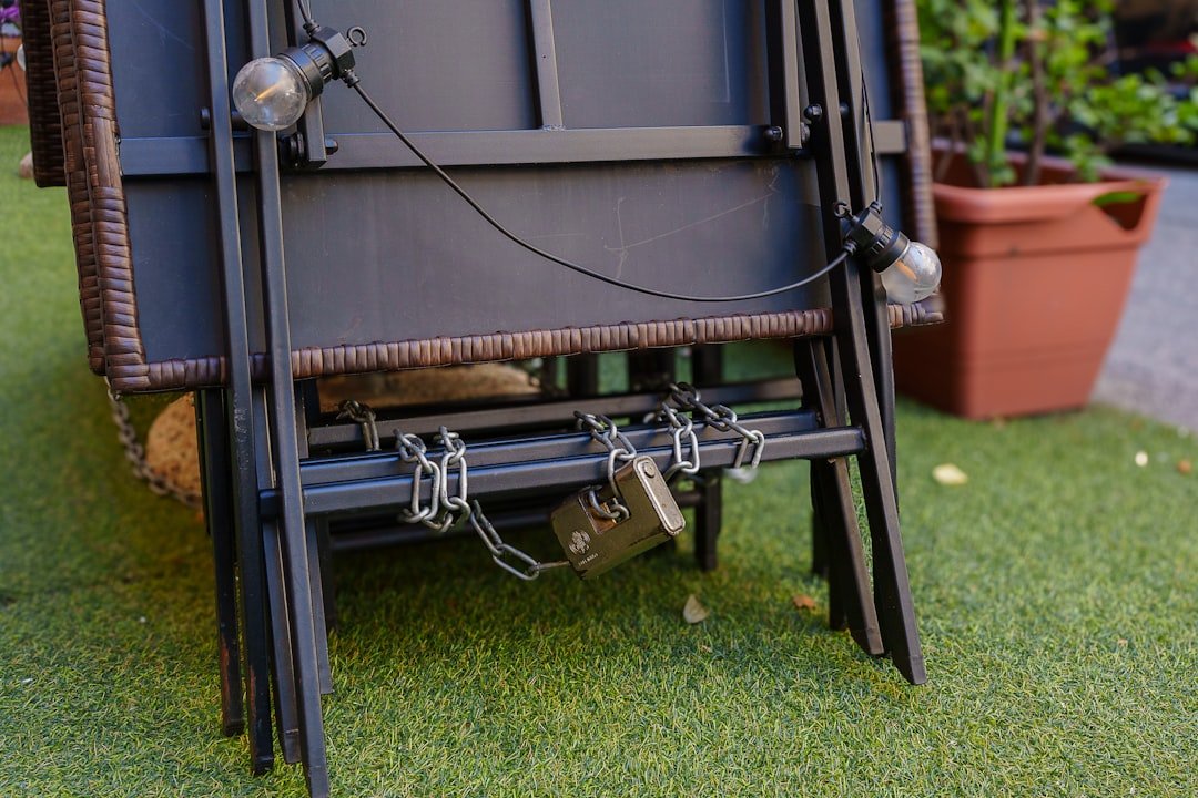 Chains securing folded chairs on artificial grass